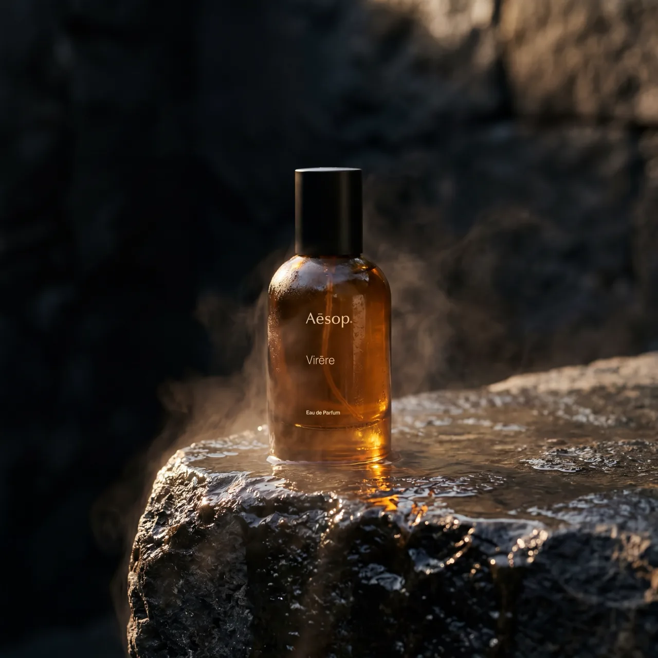 Aesop Virēre skincare concept campaign, product on wet rock in cave mist