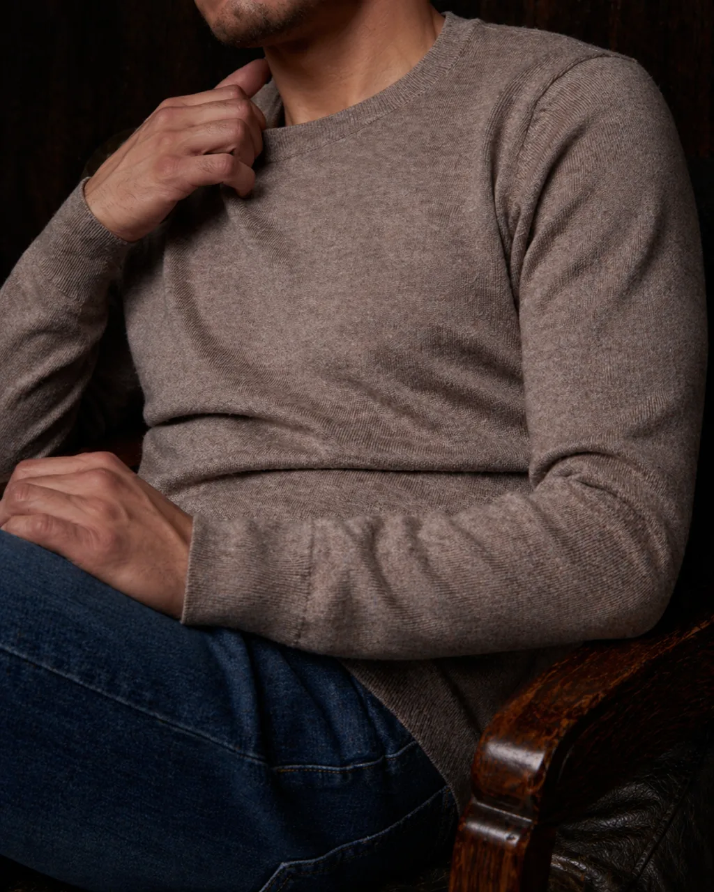 Close crop on the tan sweater knit and collar