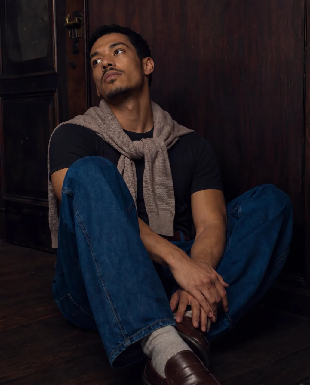 Sunderly menswear campaign, model seated on the floor looking upward