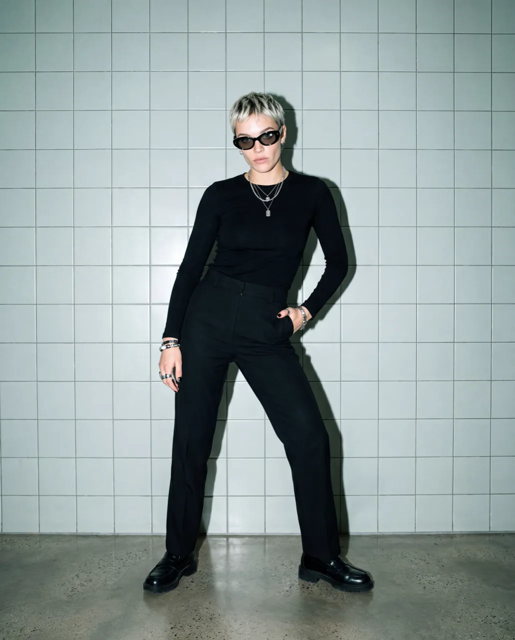 Meta smart glasses concept campaign, full-length portrait in black tailoring