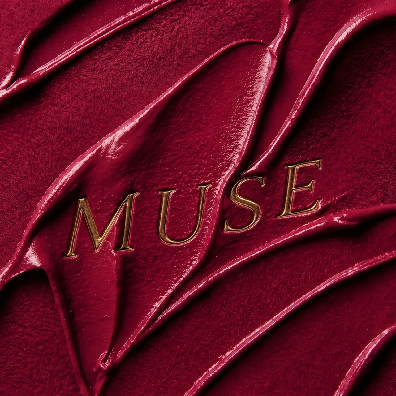 MUSE key visual: the MUSE name pressed into deep red lipstick texture