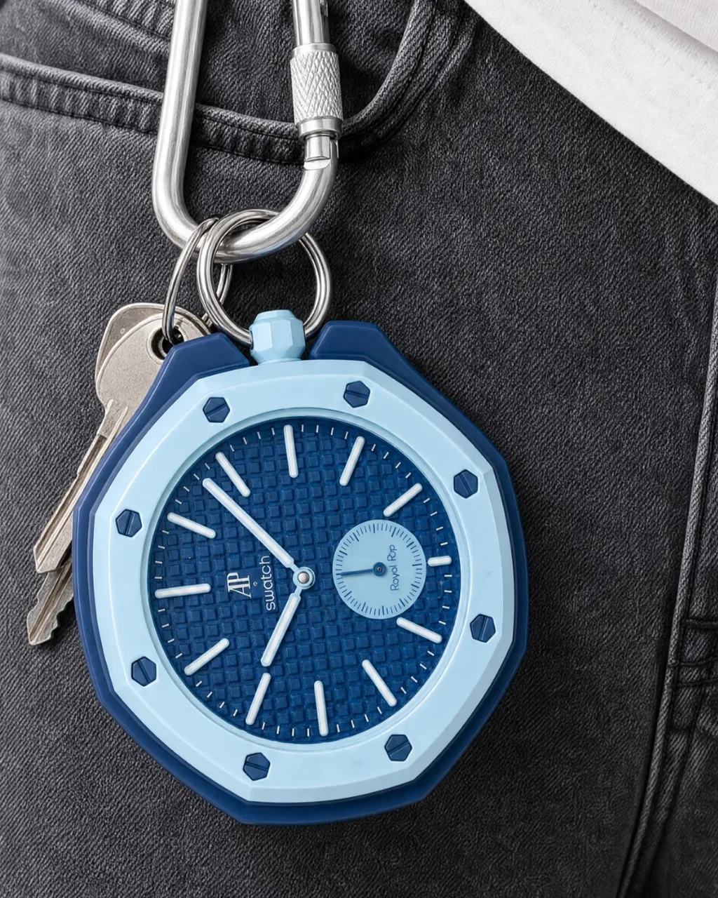 Royal POP concept campaign, pale blue watch charm clipped to keys on denim